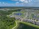 Scenic aerial shot of a residential area featuring homes, lakes and community greenery at 12931 Twin Bridges Dr, Riverview, FL 33579