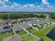 This aerial view shows the single-Gathering home with a view of the lake, and convenient neighborhood access at 12931 Twin Bridges Dr, Riverview, FL 33579