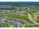 Aerial view featuring residences, roadways and communal amenities within a residential community at 12931 Twin Bridges Dr, Riverview, FL 33579