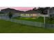 A manicured backyard with a well-maintained lawn and a white picket fence at 12931 Twin Bridges Dr, Riverview, FL 33579