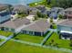 This aerial view captures the well-maintained backyard of a single-Gathering home with white fencing at 12931 Twin Bridges Dr, Riverview, FL 33579