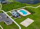 Aerial view of community pool, clubhouse, parking and beach volleyball court at 12931 Twin Bridges Dr, Riverview, FL 33579