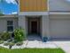 A well-maintained single-Gathering home with a manicured lawn and colorful flowerbeds that accent the front entry at 12931 Twin Bridges Dr, Riverview, FL 33579