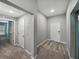 An inviting entry hallway offers easy access to the bedrooms and living areas within the single-Gathering home at 12931 Twin Bridges Dr, Riverview, FL 33579