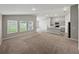 Open-concept living area with kitchen view showcasing modern finishes at 12931 Twin Bridges Dr, Riverview, FL 33579