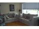 Cozy living room featuring hardwood floors and comfortable couches at 1317 Tyrone N Blvd, St Petersburg, FL 33710