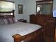 Comfortable main bedroom with a wooden bed frame and matching furniture at 1317 Tyrone N Blvd, St Petersburg, FL 33710