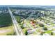 Aerial view of the property showing its location in the neighborhood with a red arrow indicator at 14096 Pullman Dr, Spring Hill, FL 34609