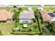 Aerial view of landscaped property, including a screened-in pool, gazebo, and mature plantings at 14096 Pullman Dr, Spring Hill, FL 34609