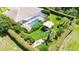Aerial view showcasing the pool, covered gazebo, and beautifully landscaped yard at 14096 Pullman Dr, Spring Hill, FL 34609