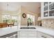 Bright kitchen showcasing a sink, and access to the dining room and backyard at 14096 Pullman Dr, Spring Hill, FL 34609