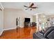 Living room featuring hardwood floors, vaulted ceiling and comfortable leather seating at 14096 Pullman Dr, Spring Hill, FL 34609