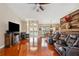 Living room showcasing an open layout, hardwood flooring and vaulted ceilings at 14096 Pullman Dr, Spring Hill, FL 34609