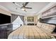 Bedroom with ceiling fan, a king bed, neutral walls, and access to the backyard at 14096 Pullman Dr, Spring Hill, FL 34609