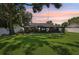 A spacious backyard featuring a large, screened patio for outdoor entertaining and relaxation at 1513 Loretta Ct, Brandon, FL 33511