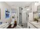 Well-lit bathroom with a glass-enclosed shower, stylish fixtures, and granite counters at 1513 Loretta Ct, Brandon, FL 33511