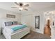Bedroom with neutral walls, ceiling fan, double closet, and an doorway into the hallway at 1513 Loretta Ct, Brandon, FL 33511