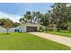 Home featuring a lush green lawn and driveway leading to an attached garage at 1513 Loretta Ct, Brandon, FL 33511