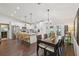 Bright kitchen with white cabinets, stainless appliances, and dining area at 1513 Loretta Ct, Brandon, FL 33511