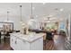 Open floor plan showcasing the kitchen island, dining area, and living room with recessed lighting at 1513 Loretta Ct, Brandon, FL 33511