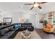 Comfortable living room with leather sectional, hardwood floors, and bright natural light at 1513 Loretta Ct, Brandon, FL 33511
