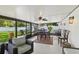 Well-decorated screened patio with dining & seating areas, and a view of the yard at 1513 Loretta Ct, Brandon, FL 33511