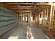 Interior of home under construction with wooden beams, concrete block walls and exposed ceiling framework at 1559 Running Tide Pl, Sarasota, FL 34240