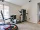 Spacious room featuring a treadmill, exercise equipment and natural light at 1610 Sanderling Ct, Brandon, FL 33511