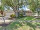 Charming single-story home with stone accents and lush landscaping at 1610 Sanderling Ct, Brandon, FL 33511