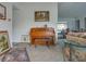 Cozy living room area with a floral sofa, trunk, and artwork creating an inviting space at 1610 Sanderling Ct, Brandon, FL 33511