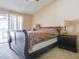 Bedroom featuring a ceiling fan, neutral colors, and an ensuite bathroom at 1610 Sanderling Ct, Brandon, FL 33511