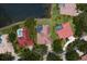 An aerial view of homes featuring a screened-in pool, and beautiful landscaping at 17807 Arbor Greene Dr, Tampa, FL 33647