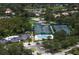 Aerial view of community amenities including a pool, clubhouse, and tennis courts at 17807 Arbor Greene Dr, Tampa, FL 33647
