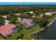 A beautiful home from an aerial perspective, complete with a screened-in pool and waterfront views at 17807 Arbor Greene Dr, Tampa, FL 33647
