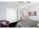 Cozy bedroom with closet, ceiling fan, sitting area, and warm colors for a comfortable atmosphere at 17807 Arbor Greene Dr, Tampa, FL 33647