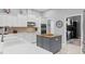 Bright kitchen with white cabinets, modern appliances, and a functional kitchen island at 17807 Arbor Greene Dr, Tampa, FL 33647