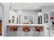 Stylish kitchen with modern bar stools, island, and stainless steel appliances at 17807 Arbor Greene Dr, Tampa, FL 33647