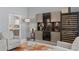 Bright living room featuring marble floors, modern furniture and a wine fridge at 17807 Arbor Greene Dr, Tampa, FL 33647