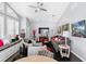 Spacious living room boasts high ceilings, large windows, comfortable seating, and ample natural light at 17807 Arbor Greene Dr, Tampa, FL 33647