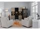 Bright living room featuring marble floors, modern furniture and a wine fridge at 17807 Arbor Greene Dr, Tampa, FL 33647