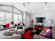 This living room includes a comfortable seating area, large windows, and built-in bench with storage at 17807 Arbor Greene Dr, Tampa, FL 33647