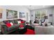 Beautiful living room featuring stylish decor, comfortable furniture, and a view of the outdoor pool area at 17807 Arbor Greene Dr, Tampa, FL 33647