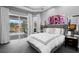Comfortable main bedroom with view to the pool, neutral tones, and modern decor at 17807 Arbor Greene Dr, Tampa, FL 33647