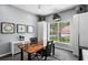 Modern office showcasing a unique desk, storage, and a window overlooking the landscaped yard at 17807 Arbor Greene Dr, Tampa, FL 33647