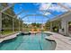 Inviting screened-in pool with a spa and lounge chairs offers a relaxing outdoor space at 17807 Arbor Greene Dr, Tampa, FL 33647