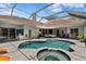 Inviting screened-in pool with a spa offers a relaxing outdoor space at 17807 Arbor Greene Dr, Tampa, FL 33647