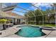 Inviting screened-in pool with a spa offers a relaxing outdoor space at 17807 Arbor Greene Dr, Tampa, FL 33647