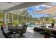Screened-in patio featuring a pool, spa, and an outdoor seating area perfect for entertaining at 17807 Arbor Greene Dr, Tampa, FL 33647