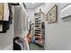 Walk-in closet with clothing racks, shelving for shoes and bags, and room for storage at 17807 Arbor Greene Dr, Tampa, FL 33647