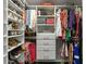 Spacious walk-in closet with custom shelving for clothing, shoes and accessories at 17807 Arbor Greene Dr, Tampa, FL 33647